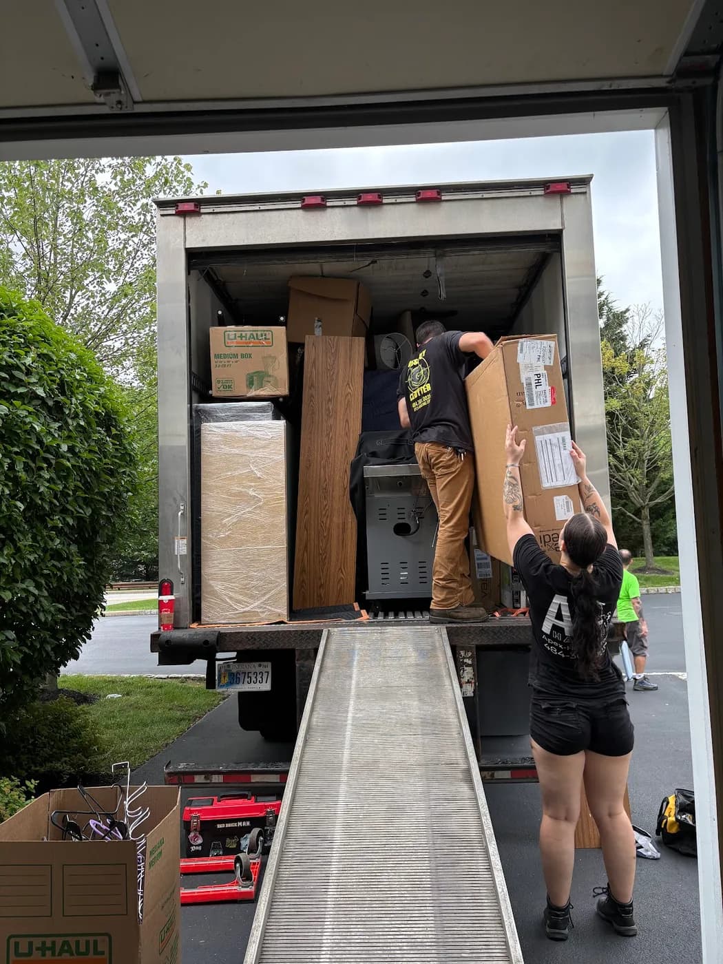 Apex crew loading a truck by ramp