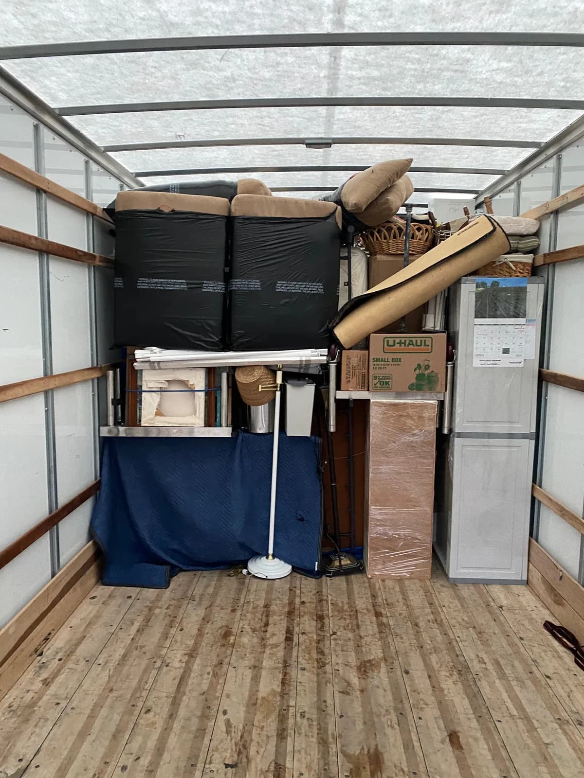 A loaded truck with padded furniture